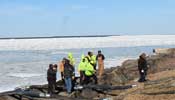 water team standing on the shore